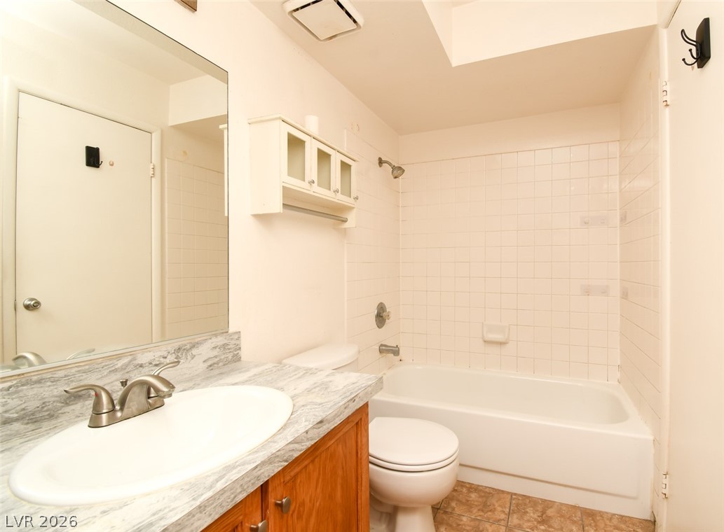 7570 West Flamingo Road, Unit 119 Las Vegas, NV 89147 - Photo 10 of 15 A well-maintained full bathroom offers a classic tub and shower combination with a single vanity.