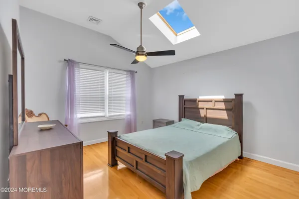a bathroom with a granite countertop toilet and a shower