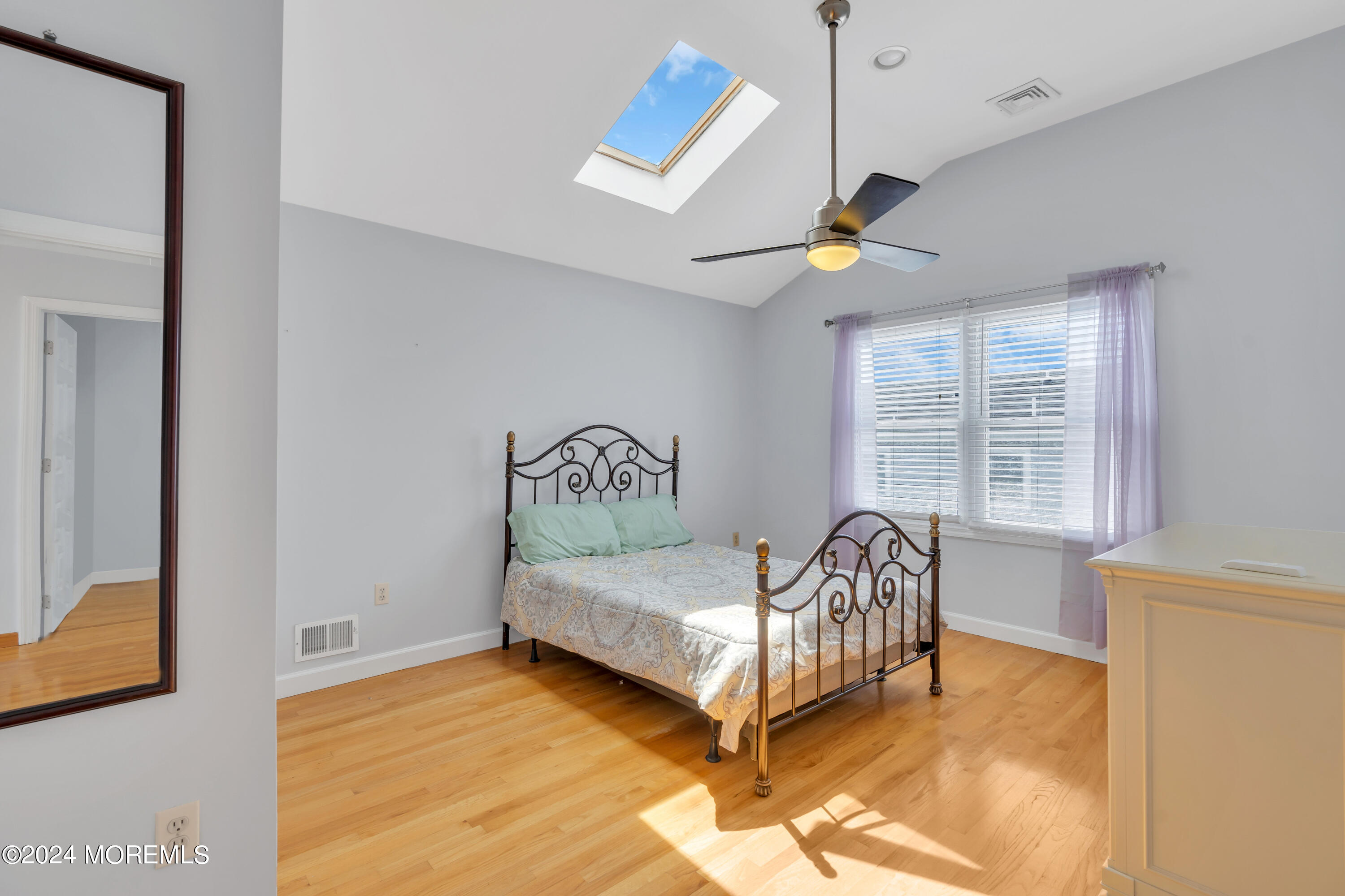117 Harding Avenue Seaside Heights, NJ 08751 - Photo 18 of 28 a bedroom with a bed and a window