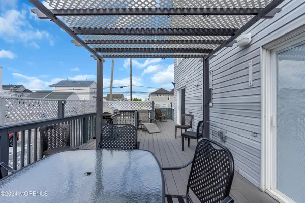 a view of a patio with a table and chairs