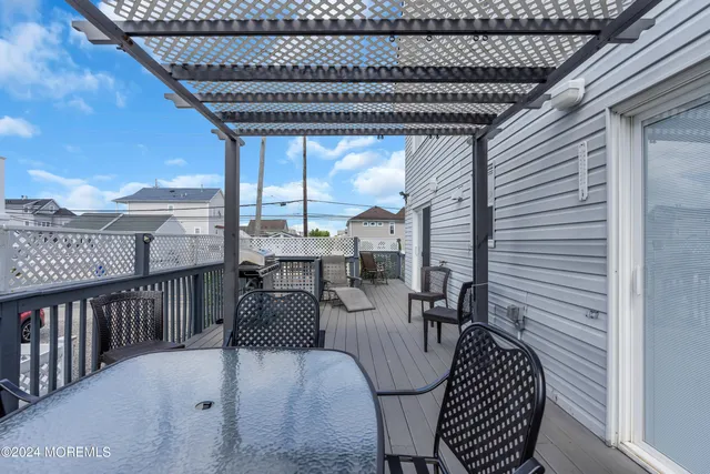 a view of a patio with a table and chairs