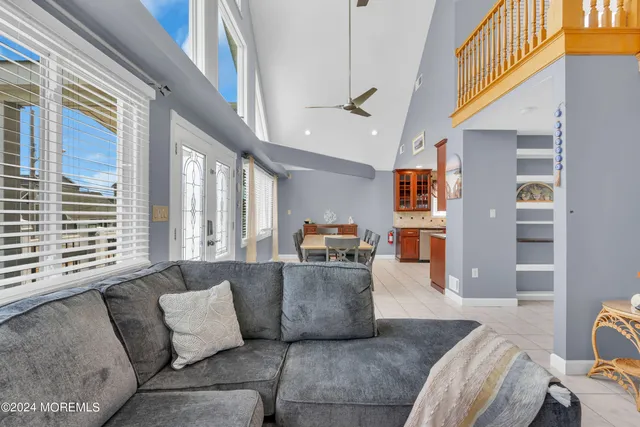 a view of an entryway and hall with wooden floor