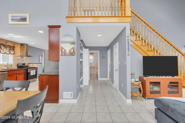 a dining table with chairs and window