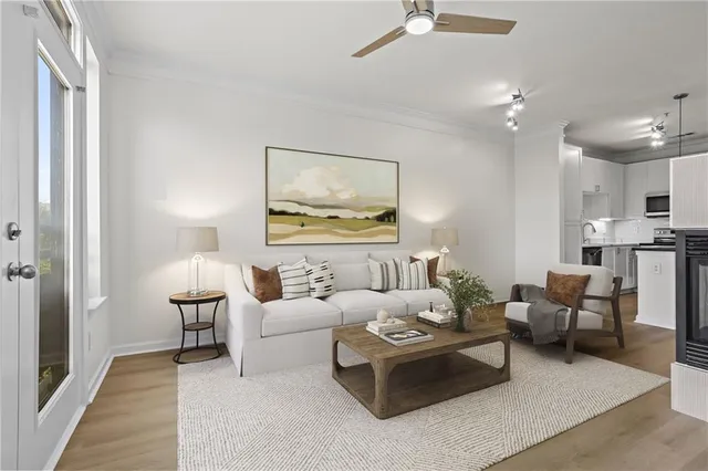 a living room with furniture and a lamp