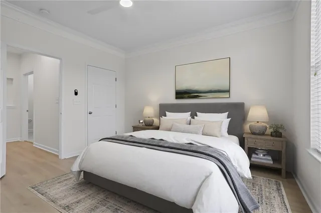 a bedroom with double bed and a window