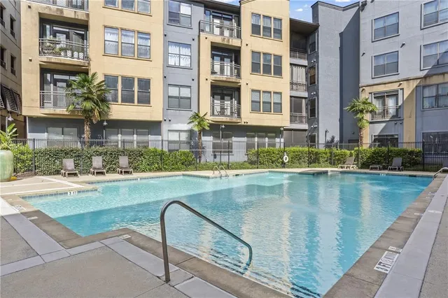 a view of pool with outdoor seating