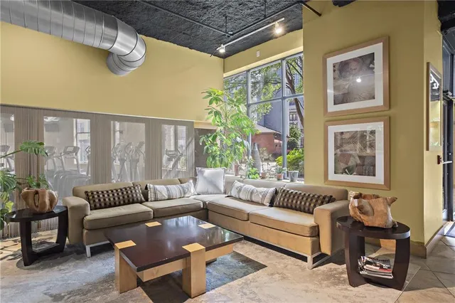 a view of a patio with couches and potted plants
