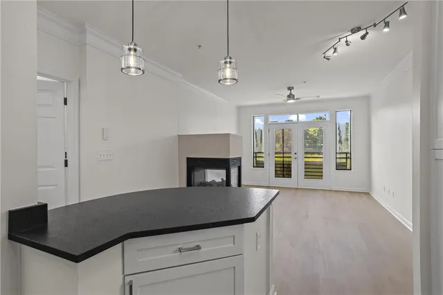 a view of a room with furniture and a window