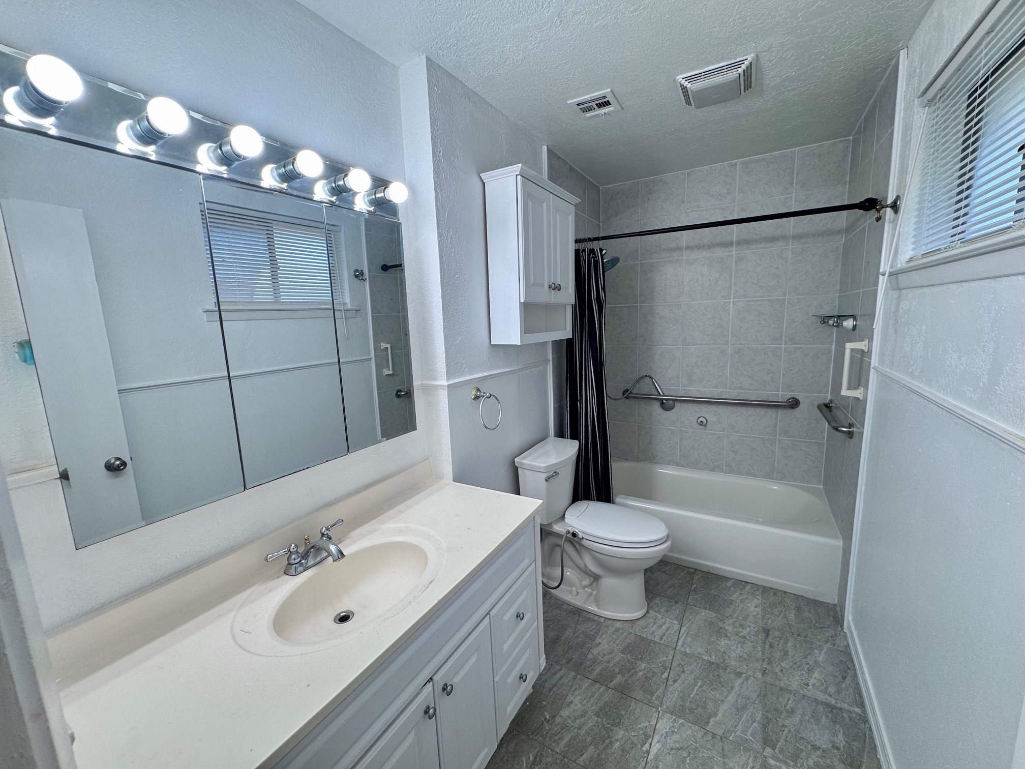 2006 Seagate Lane Houston, TX 77062 - Photo 13 of 22 a bathroom with a double vanity sink toilet mirror and shower