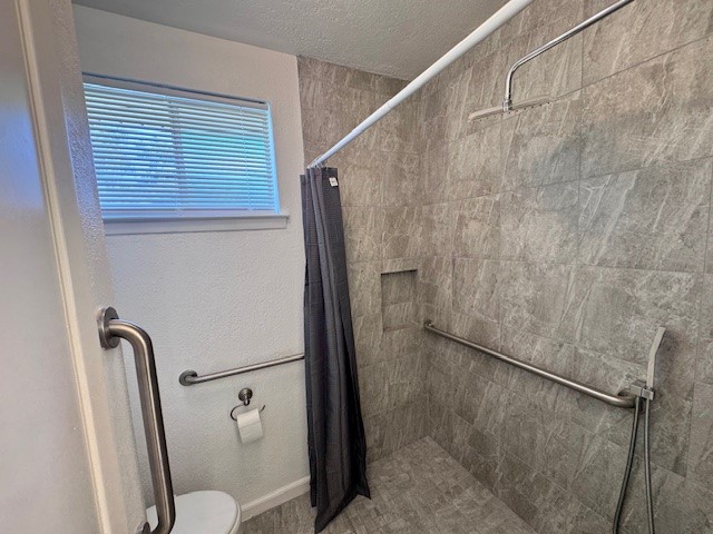 2006 Seagate Lane Houston, TX 77062 - Photo 15 of 22 a bathroom with a granite countertop shower and a toilet