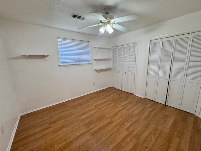 2006 Seagate Lane Houston, TX 77062 - Photo 19 of 22 a view of empty room with wooden floor and fan