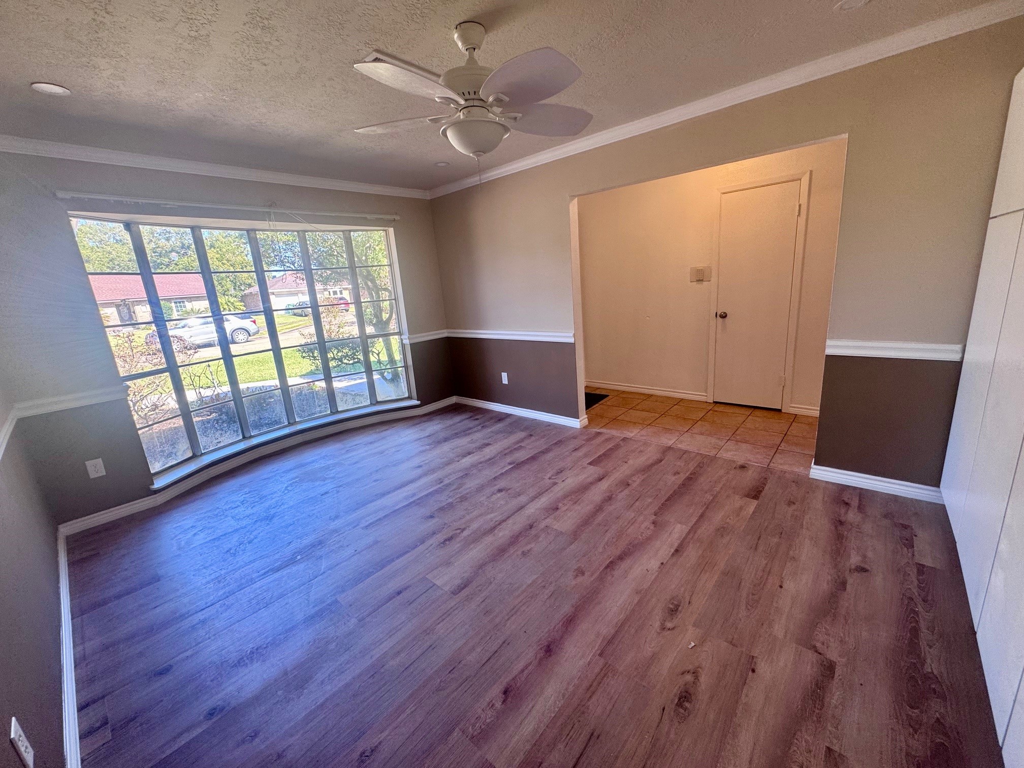 2006 Seagate Lane Houston, TX 77062 - Photo 6 of 22 an empty room with wooden floor and windows