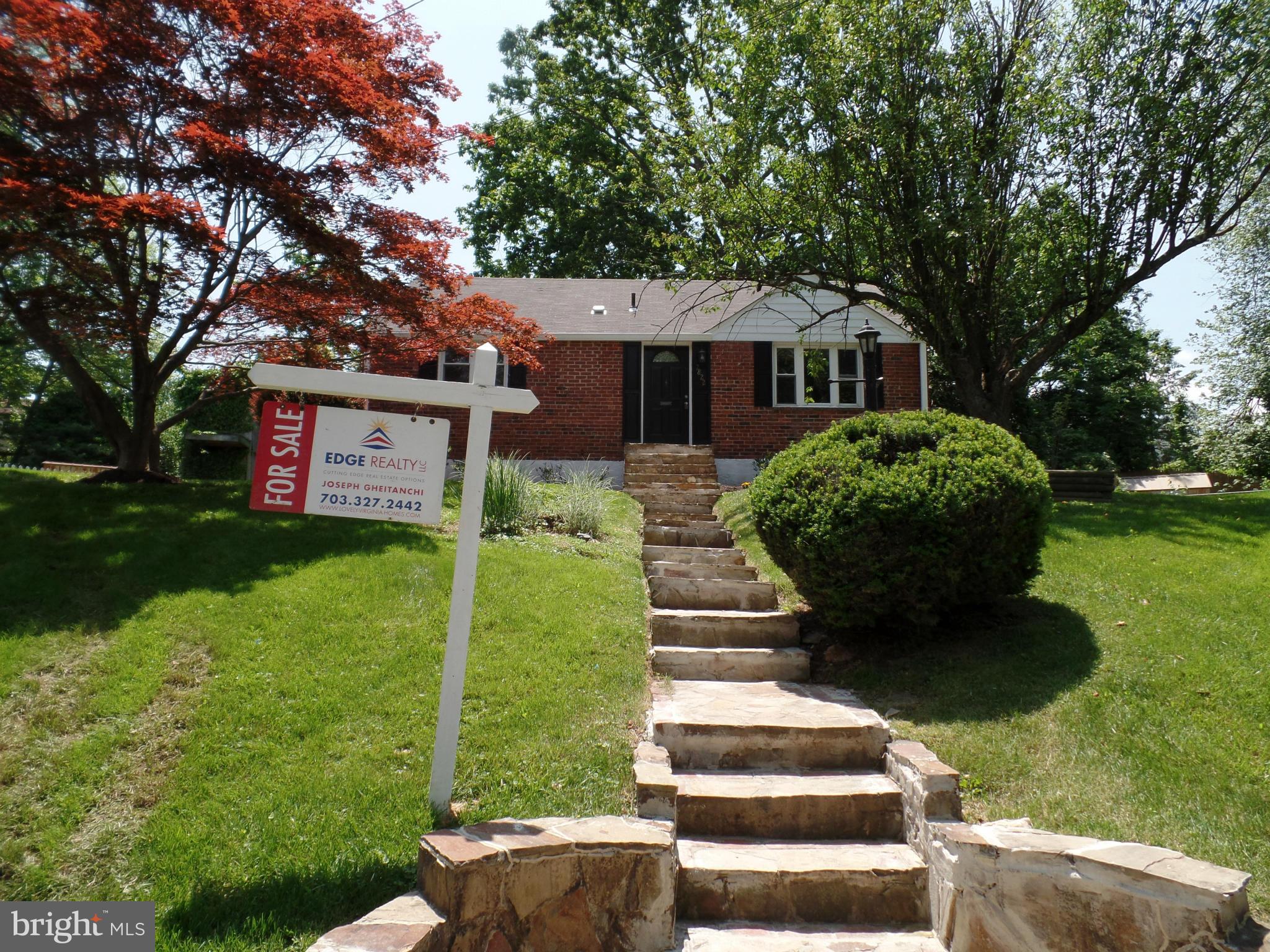2822 Denley Place Silver Spring, MD 20906 - Photo 1 of 18 a front view of a house with garden