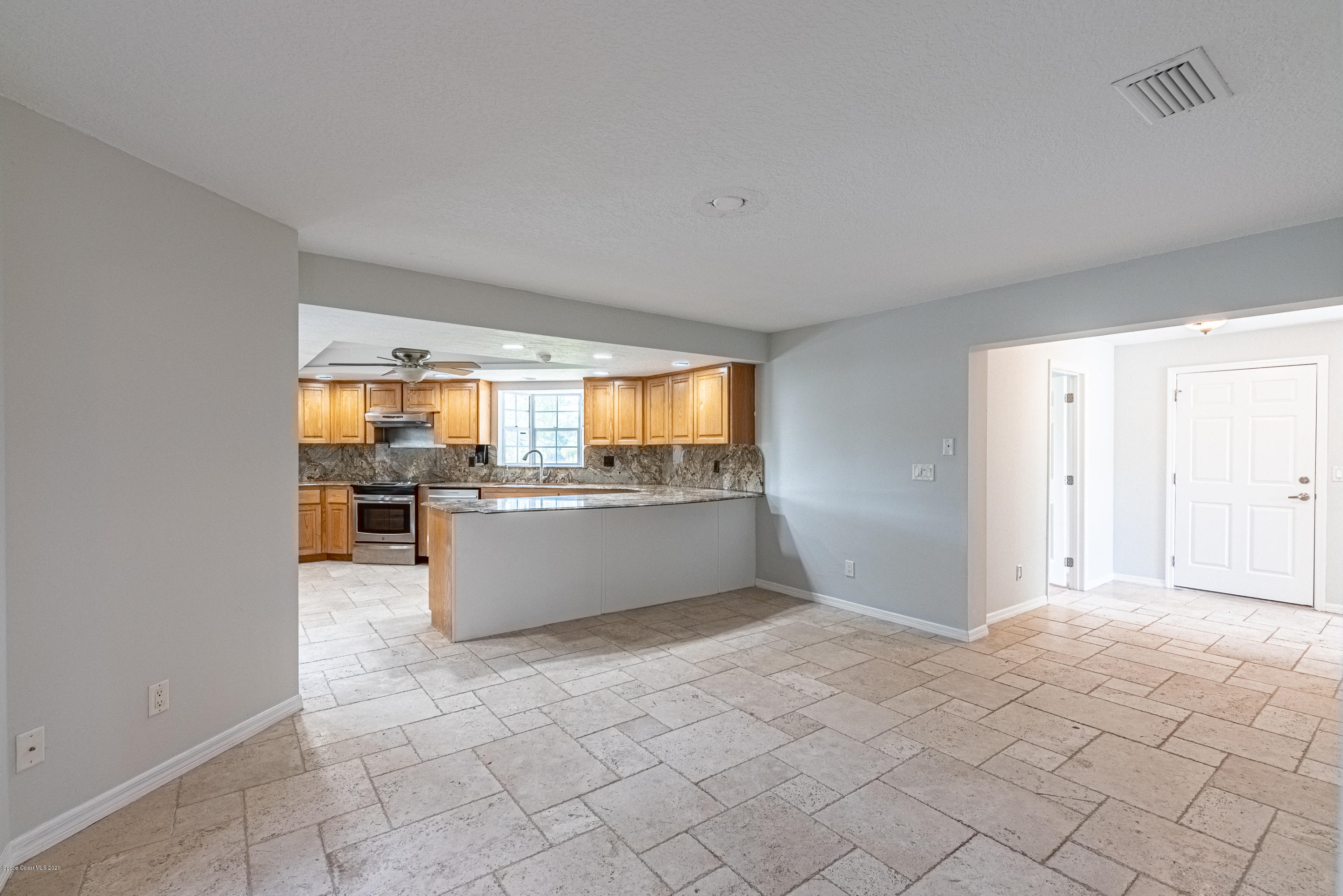 4300 Pinewood Road Melbourne, FL 32934 - Photo 20 of 60 a view of kitchen with windows