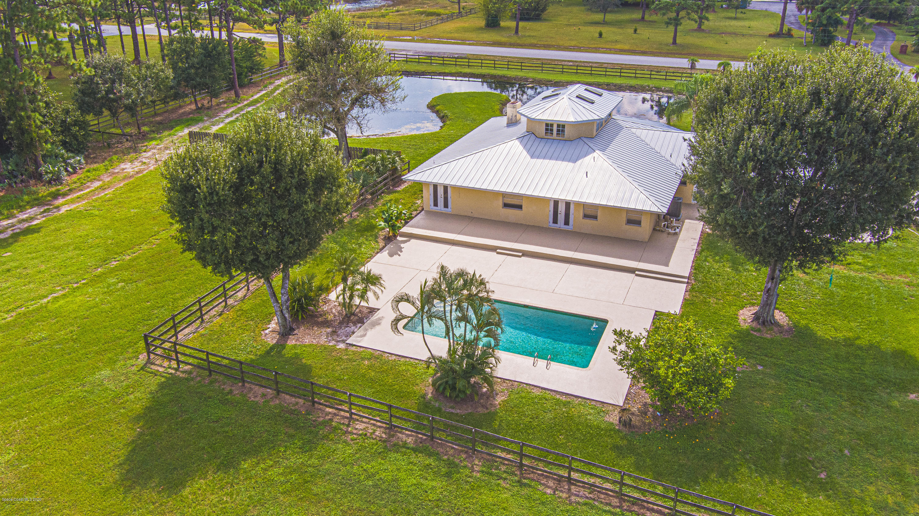 4300 Pinewood Road Melbourne, FL 32934 - Photo 3 of 60 a aerial view of a house with a yard