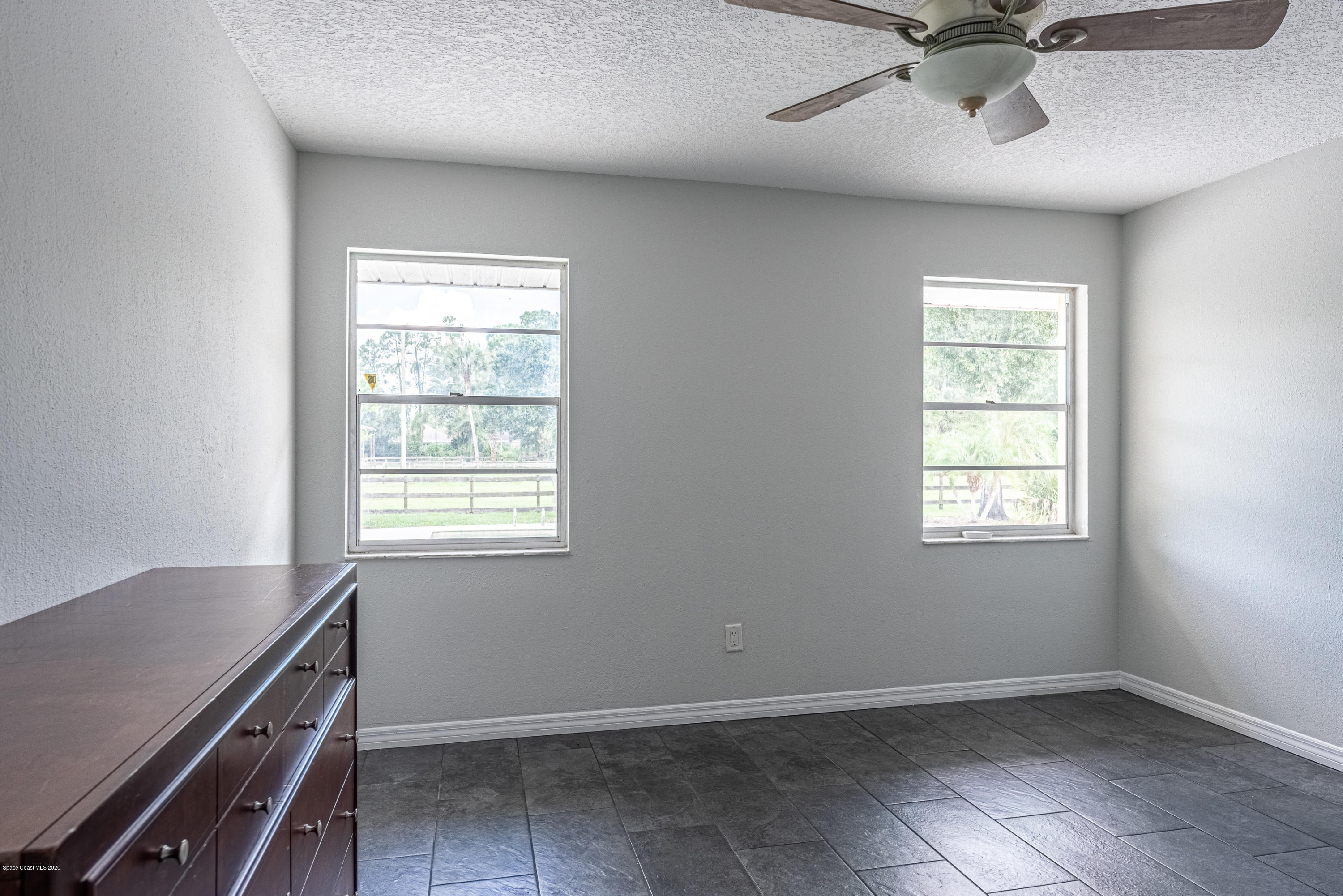 4300 Pinewood Road Melbourne, FL 32934 - Photo 29 of 60 a view of an empty room with a window