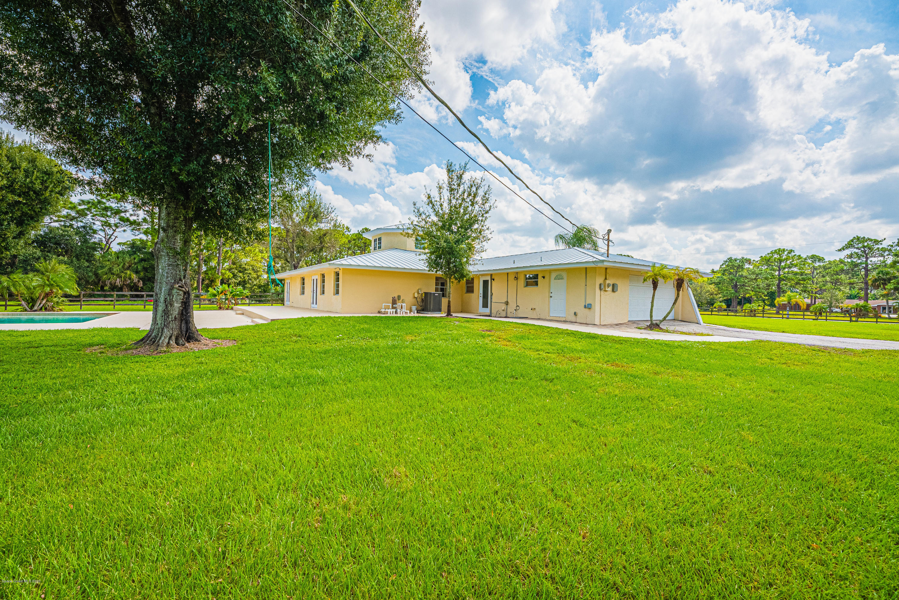 4300 Pinewood Road Melbourne, FL 32934 - Photo 4 of 60 a view of house with garden