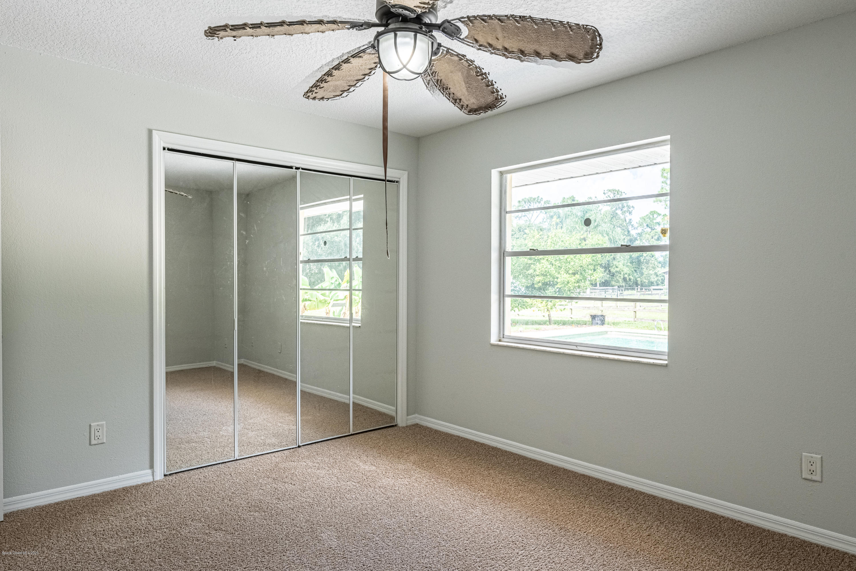 4300 Pinewood Road Melbourne, FL 32934 - Photo 34 of 60 a view of an empty room with a window