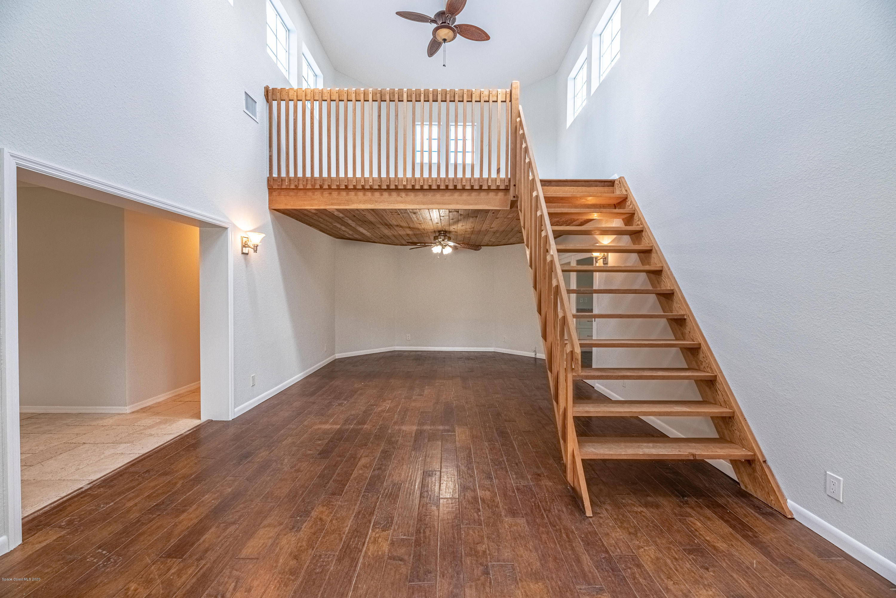 4300 Pinewood Road Melbourne, FL 32934 - Photo 35 of 60 wooden floor in an empty room with a window