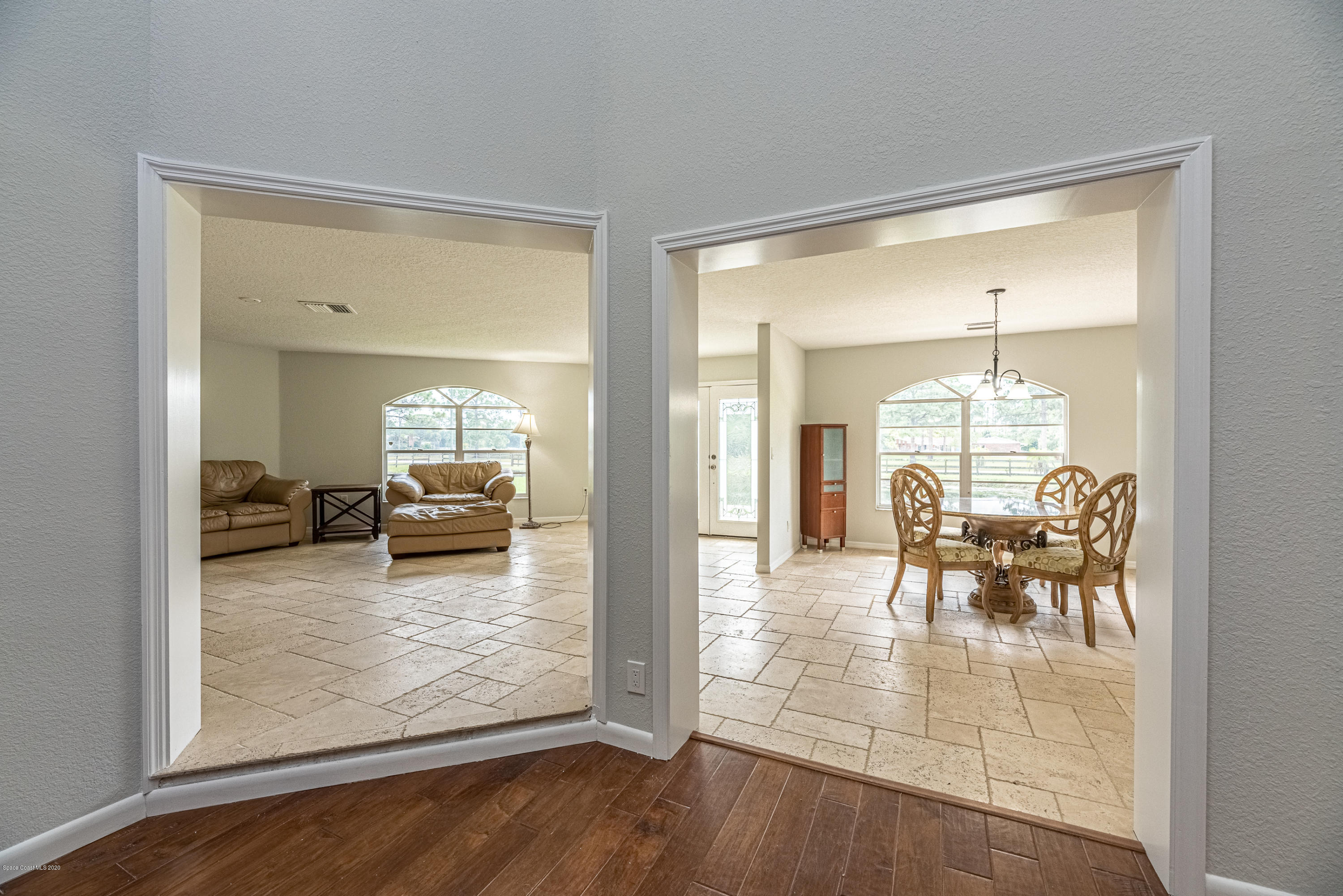 4300 Pinewood Road Melbourne, FL 32934 - Photo 39 of 60 a living room with furniture and a fireplace