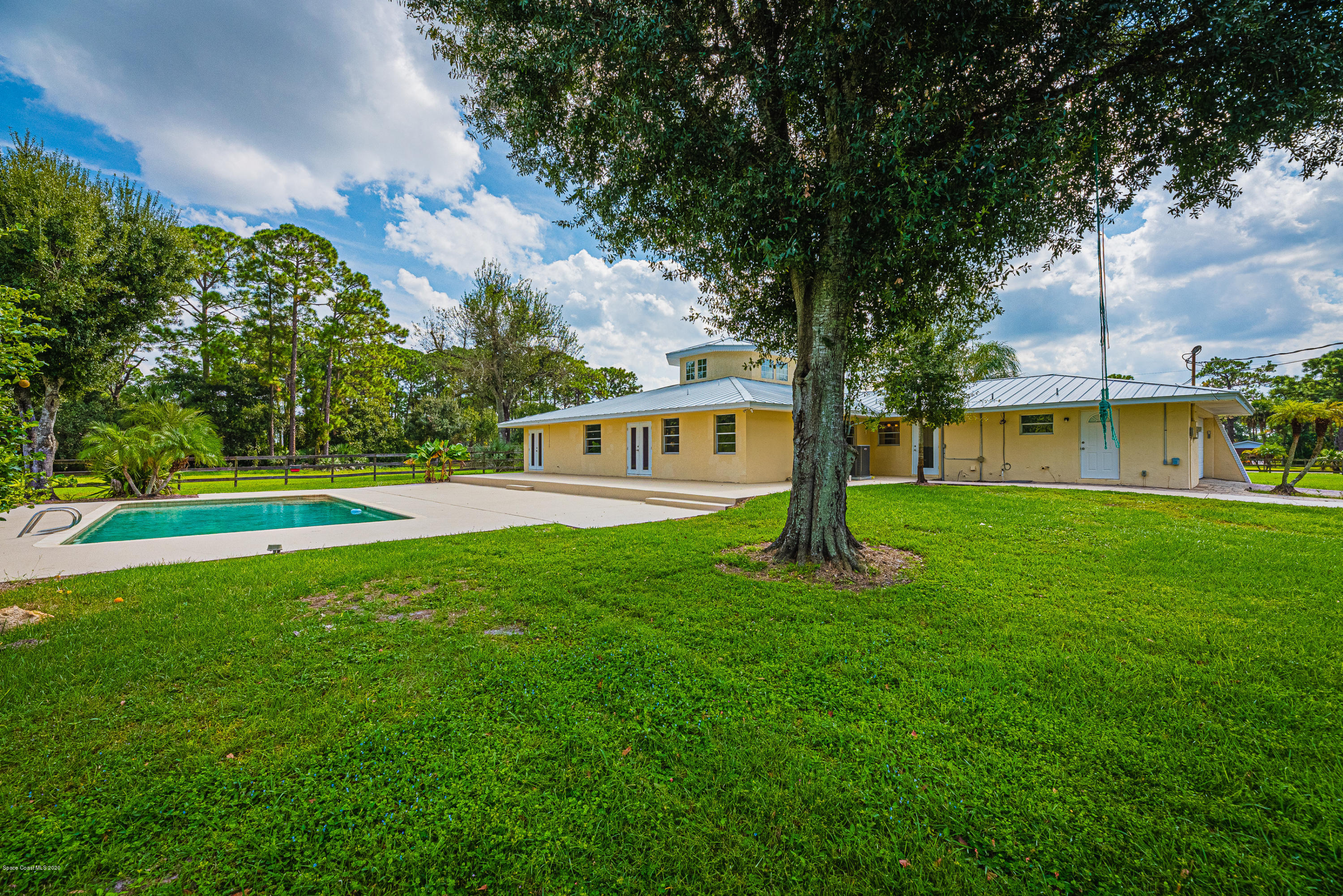 4300 Pinewood Road Melbourne, FL 32934 - Photo 5 of 60 a view of a house with a big yard