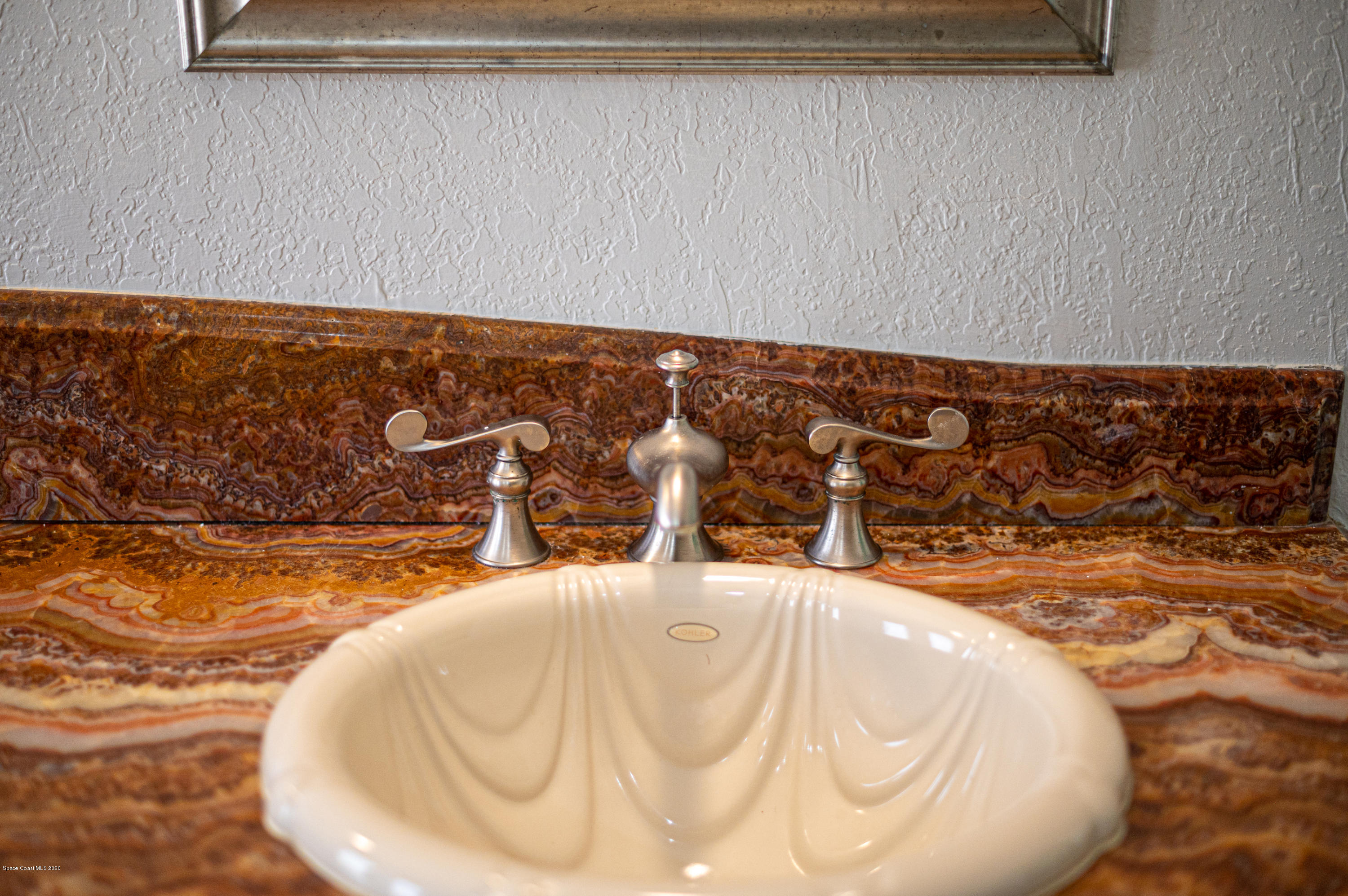 4300 Pinewood Road Melbourne, FL 32934 - Photo 51 of 60 a bathroom with a bathtub