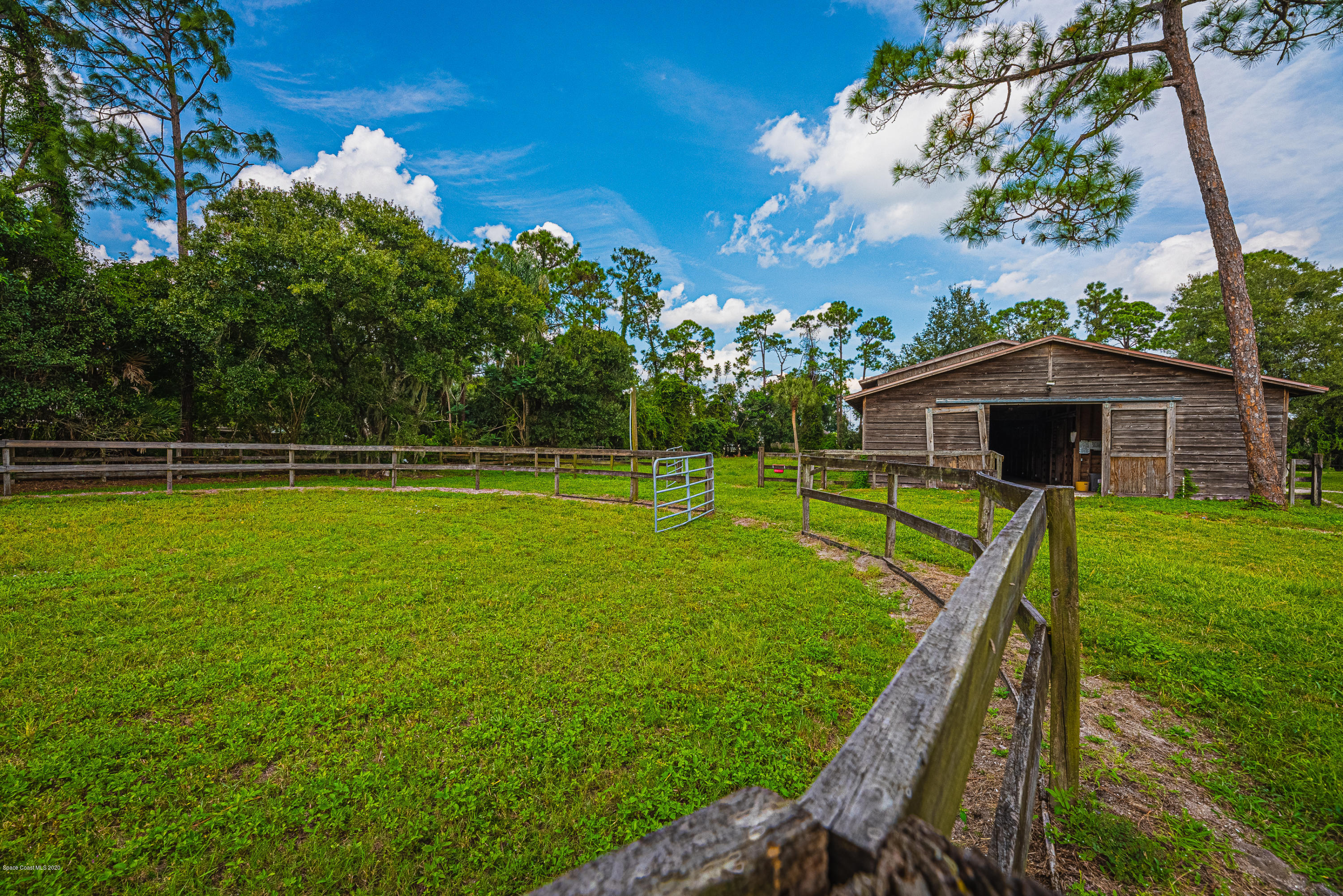 4300 Pinewood Road Melbourne, FL 32934 - Photo 58 of 60 a view of a house with a yard