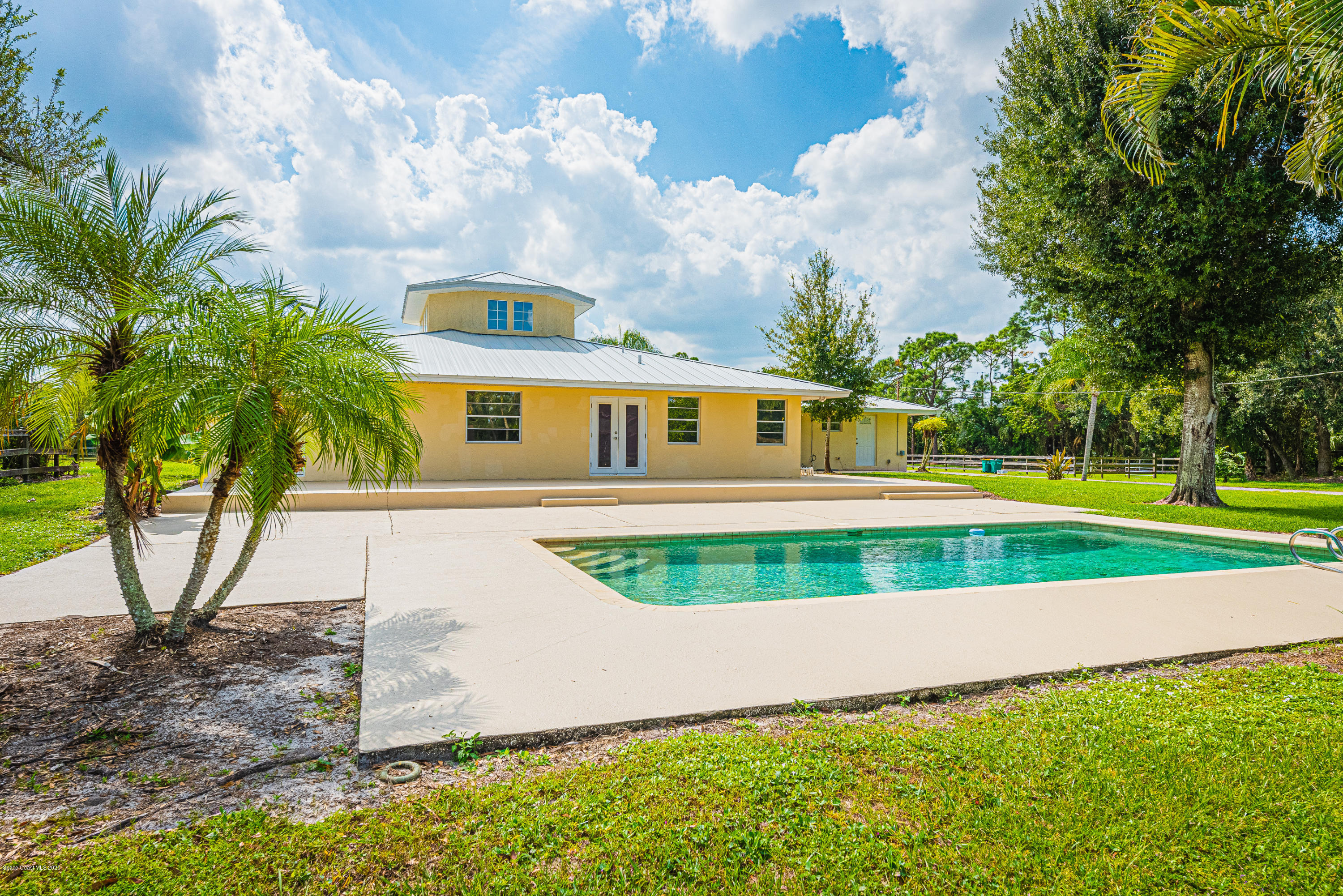 4300 Pinewood Road Melbourne, FL 32934 - Photo 7 of 60 a view of a house with a yard