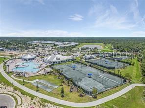 14132 Poppy Fld Loop, Unit 4022 Punta Gorda, FL 33955 - Photo 12 of 17 a view of a swimming pool with an ocean view