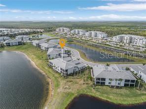 14132 Poppy Fld Loop, Unit 4022 Punta Gorda, FL 33955 - Photo 13 of 17 a view of a lake in middle of the town
