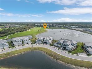 14132 Poppy Fld Loop, Unit 4022 Punta Gorda, FL 33955 - Photo 15 of 17 an aerial view of a house with a garden