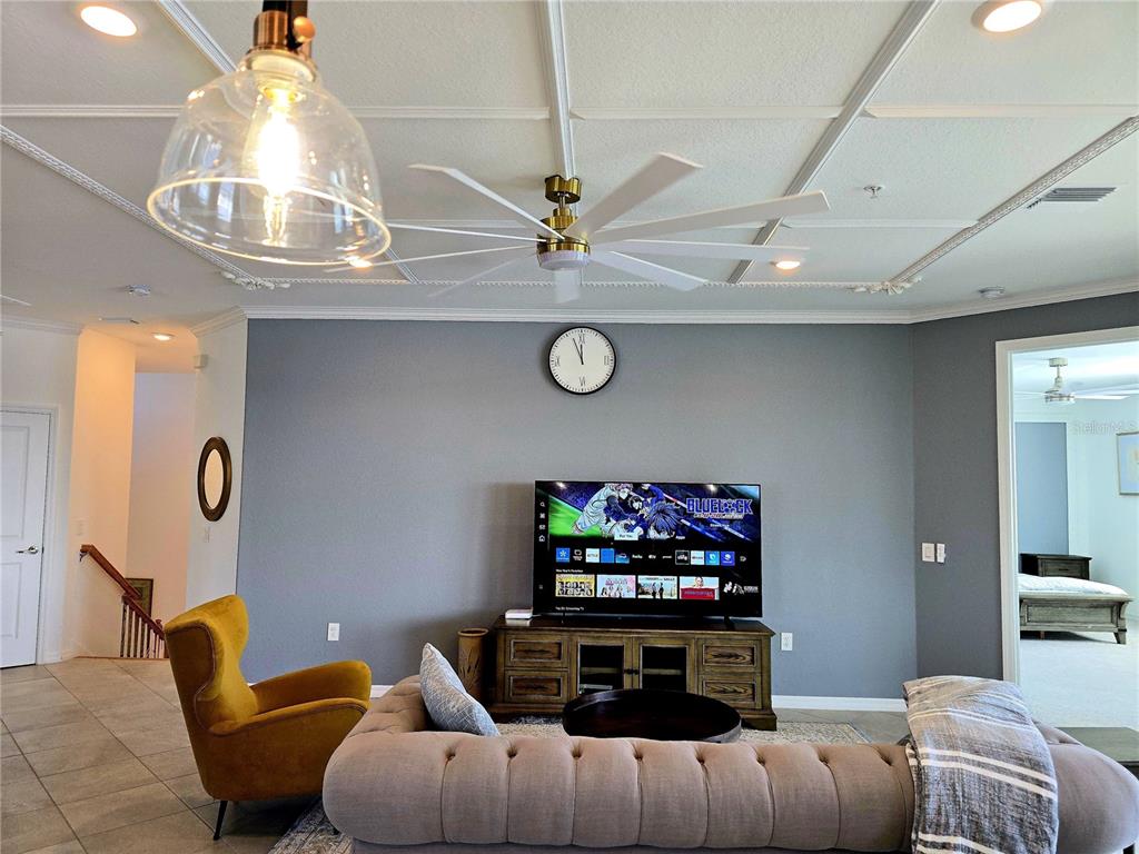 14132 Poppy Fld Loop, Unit 4022 Punta Gorda, FL 33955 - Photo 5 of 17 a living room with furniture and a flat screen tv