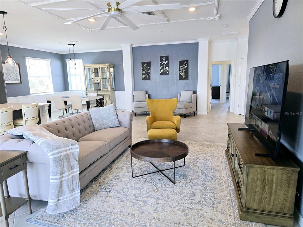 14132 Poppy Fld Loop, Unit 4022 Punta Gorda, FL 33955 - Photo 6 of 17 a living room with furniture and a flat screen tv