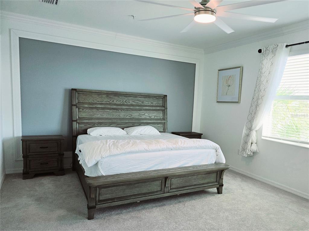 14132 Poppy Fld Loop, Unit 4022 Punta Gorda, FL 33955 - Photo 8 of 17 a bedroom with a bed and window