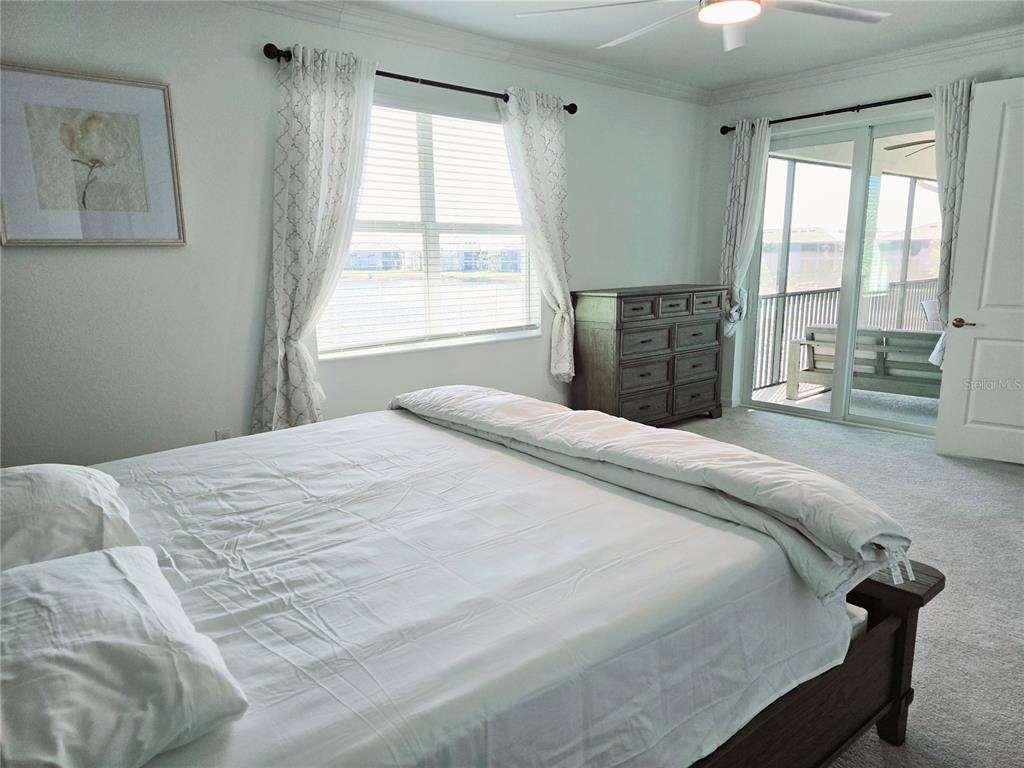 14132 Poppy Fld Loop, Unit 4022 Punta Gorda, FL 33955 - Photo 10 of 17 a bedroom with a bed and a window