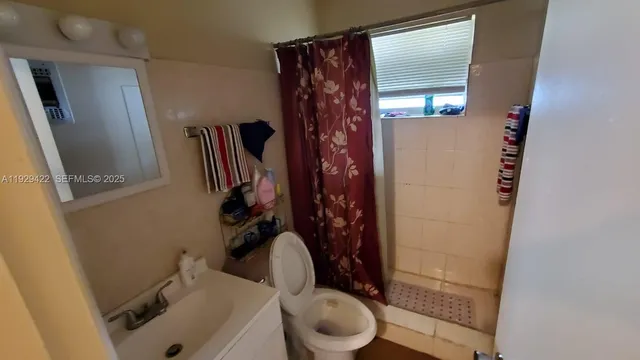 a bathroom with a toilet and a sink