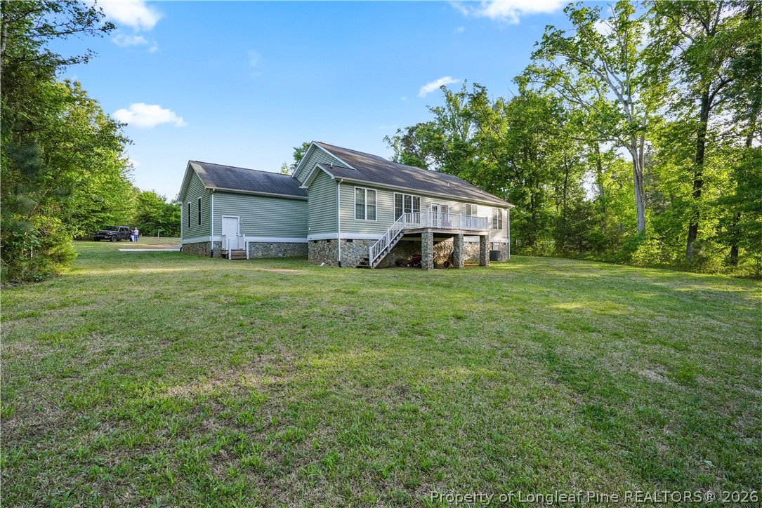 280 Hemp St Extension Robbins, NC 27325 - Photo 25 of 29 a view of a house with a big yard and large trees