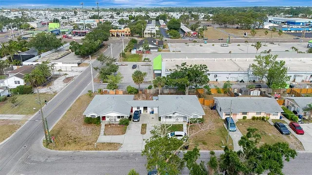 an aerial view of residential houses with outdoor space