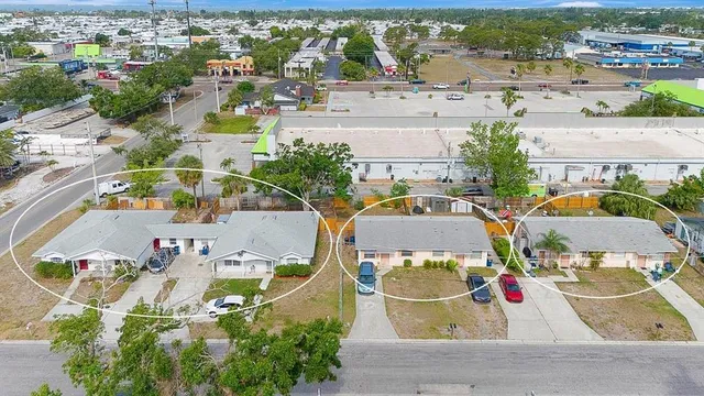 an aerial view of residential houses with outdoor space
