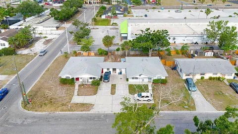 an aerial view of residential houses with outdoor space