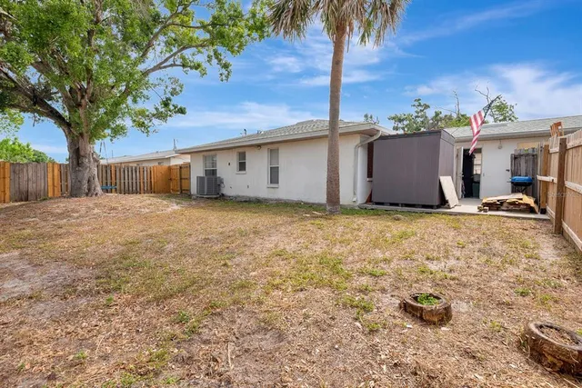a view of a backyard of a house