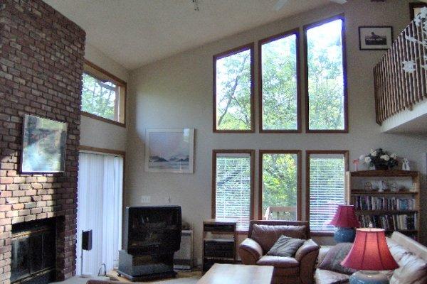 742 Hampstead Road Bushkill, PA 18324 - Photo 3 of 14 a living room with furniture a flat screen tv and a fireplace