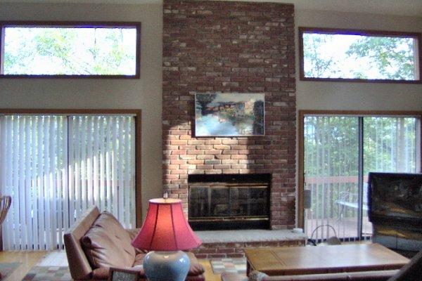 742 Hampstead Road Bushkill, PA 18324 - Photo 5 of 14 a living room with furniture a flat screen tv and a fireplace