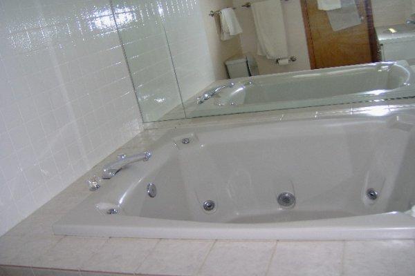 742 Hampstead Road Bushkill, PA 18324 - Photo 8 of 14 a bathroom with a granite countertop sink and a mirror