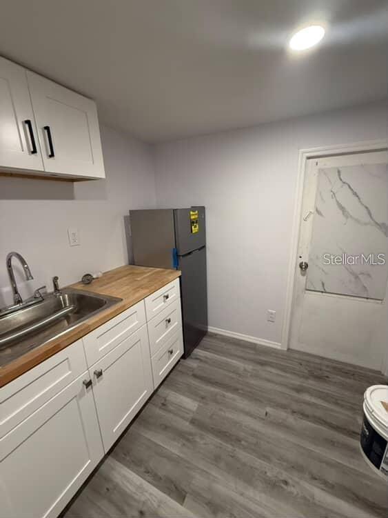 5500 North Rome Avenue, Unit 29 Tampa, FL 33603 - Photo 1 of 10 a kitchen with a sink and cabinets