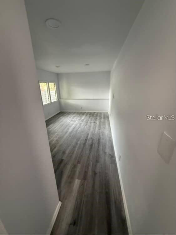 5500 North Rome Avenue, Unit 29 Tampa, FL 33603 - Photo 5 of 10 wooden floor in a empty room with a window