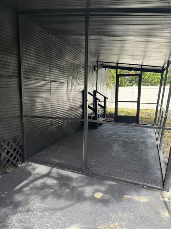 5500 North Rome Avenue, Unit 29 Tampa, FL 33603 - Photo 8 of 10 a view of a porch with a door