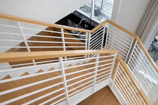 a view of a glass door and a balcony