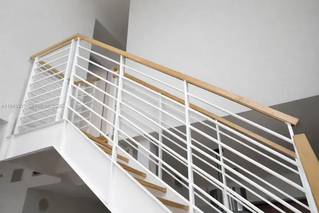 a bathroom with a shower a toilet and a sink