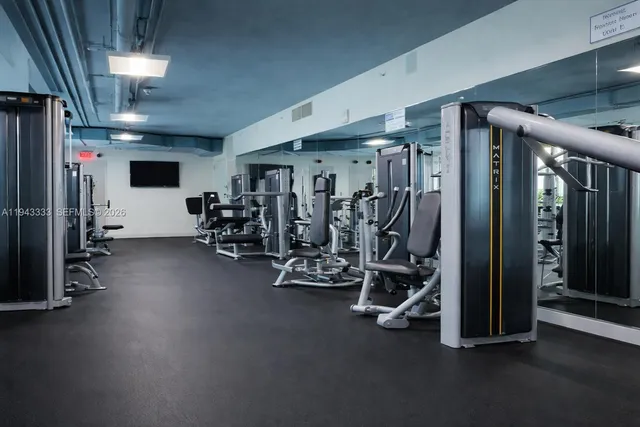 a living room with a book shelf